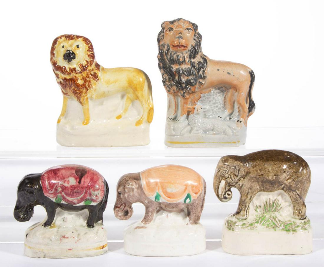 ENGLISH STAFFORDSHIRE HAND-PAINTED CERAMIC ANIMAL: ENGLISH STAFFORDSHIRE HAND-PAINTED CERAMIC ANIMAL FIGURES, LOT OF FIVE, each on oval base, comprising three standing elephants with curled trunks including two having blankets on backs, and two standi