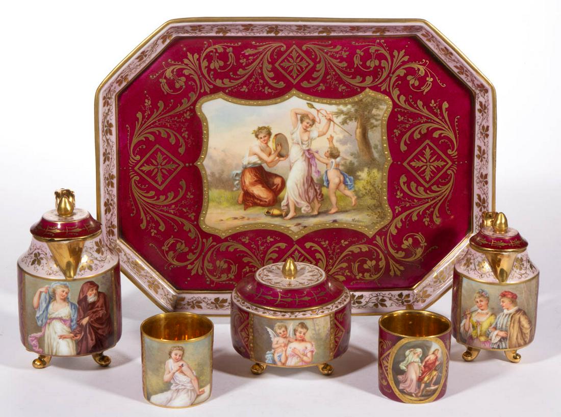 AUSTRIAN ROYAL VIENNA PORCELAIN SIX-PIECE DEMITASSE SET: AUSTRIAN ROYAL VIENNA PORCELAIN SIX-PIECE DEMITASSE SET, each having polychrome hand-painted romantic scenes, each titled to underside, on magenta and pink ground with elaborate gilt foliate and scrol