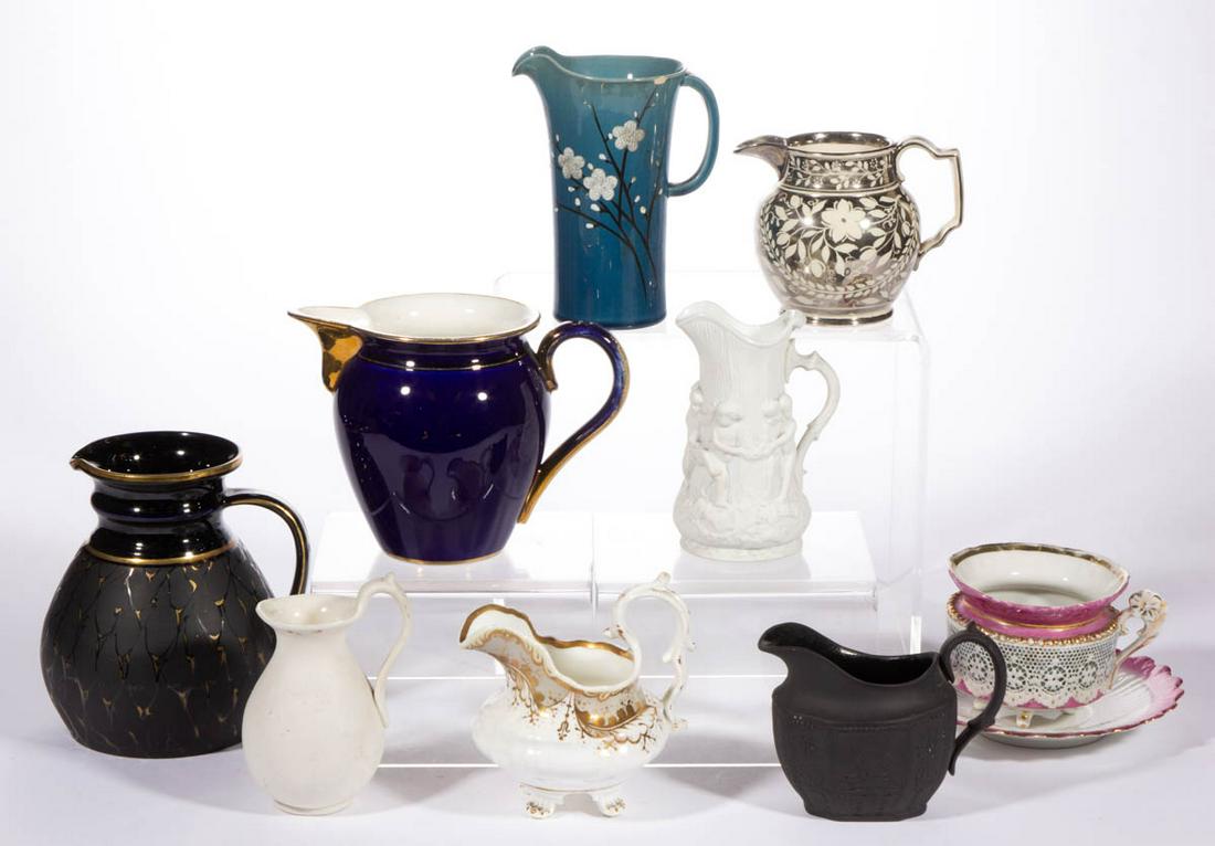 ASSORTED CERAMIC TEA AND TABLE ARTICLES, LOT OF TEN: ASSORTED CERAMIC TEA AND TABLE ARTICLES, LOT OF TEN, including a black basaltware creamer with relief cherub decoration, a porcelain mustache cup and saucer set with pink and gilt decorations, a small