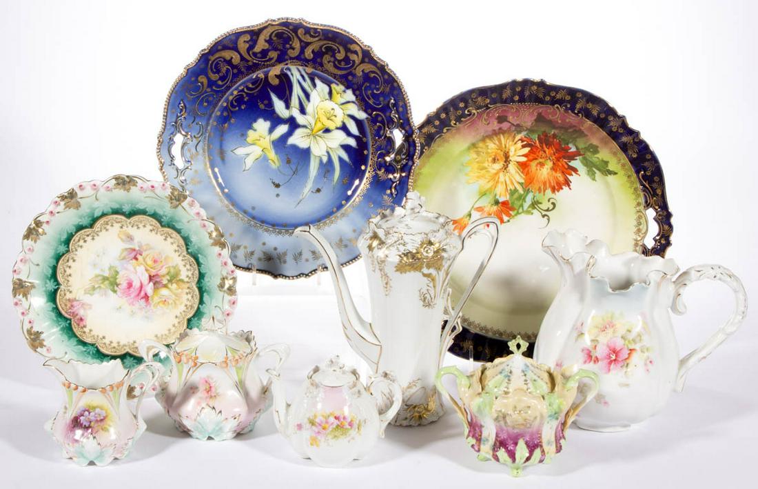 R.S. PRUSSIA AND OTHER FLORAL MOTIF PORCELAIN ARTICLES,: R.S. PRUSSIA AND OTHER FLORAL MOTIF PORCELAIN ARTICLES, LOT OF NINE, including a Mold 28 coffee pot, a Mold 703 covered sugar bowl, two cake plates including a Mold 343 example with beautiful daffodil