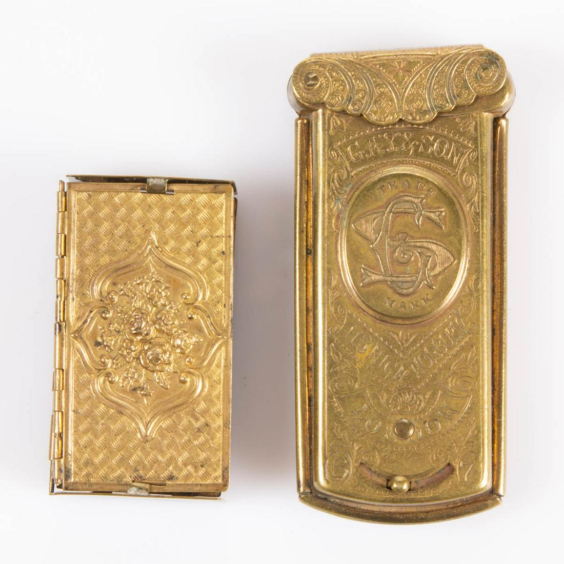 ASSORTED MANUFACTURERS BRASS NEEDLE CASES, LOT OF TWO: ASSORTED MANUFACTURERS BRASS NEEDLE CASES, LOT OF TWO, comprising a Gay & Son with hinged cover having interior fitted with four sleeves which are activated by sliding buttons, and an accordion Gem st