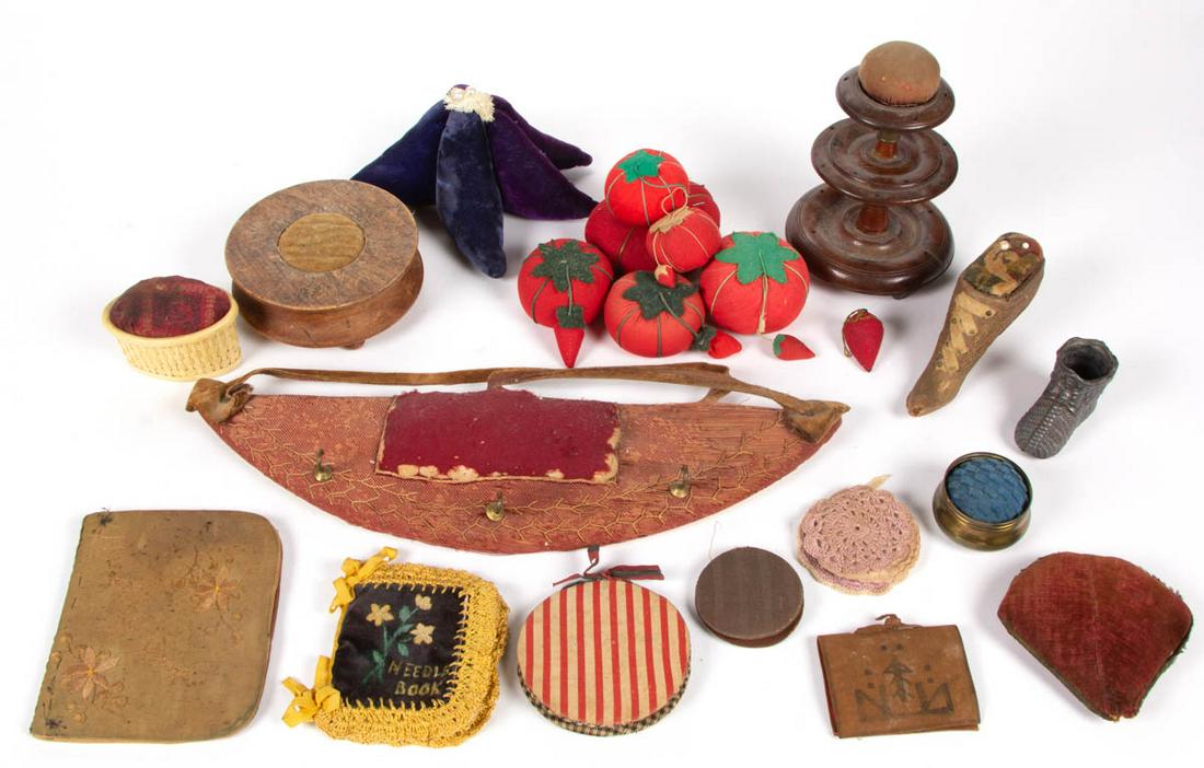ASSORTED FABRIC AND OTHER PINCUSHIONS AND NEEDLE CASES,: ASSORTED FABRIC AND OTHER PINCUSHIONS AND NEEDLE CASES, LOT OF 22, including seven figural tomatoes with several having a strawberry-form emery, three wood examples including a shoe form and a tiered
