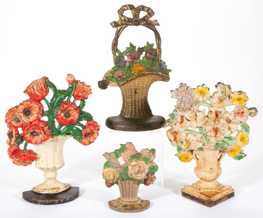 CAST-IRON FIGURAL FLORAL DOOR STOPS, LOT OF FOUR (1 of 2)