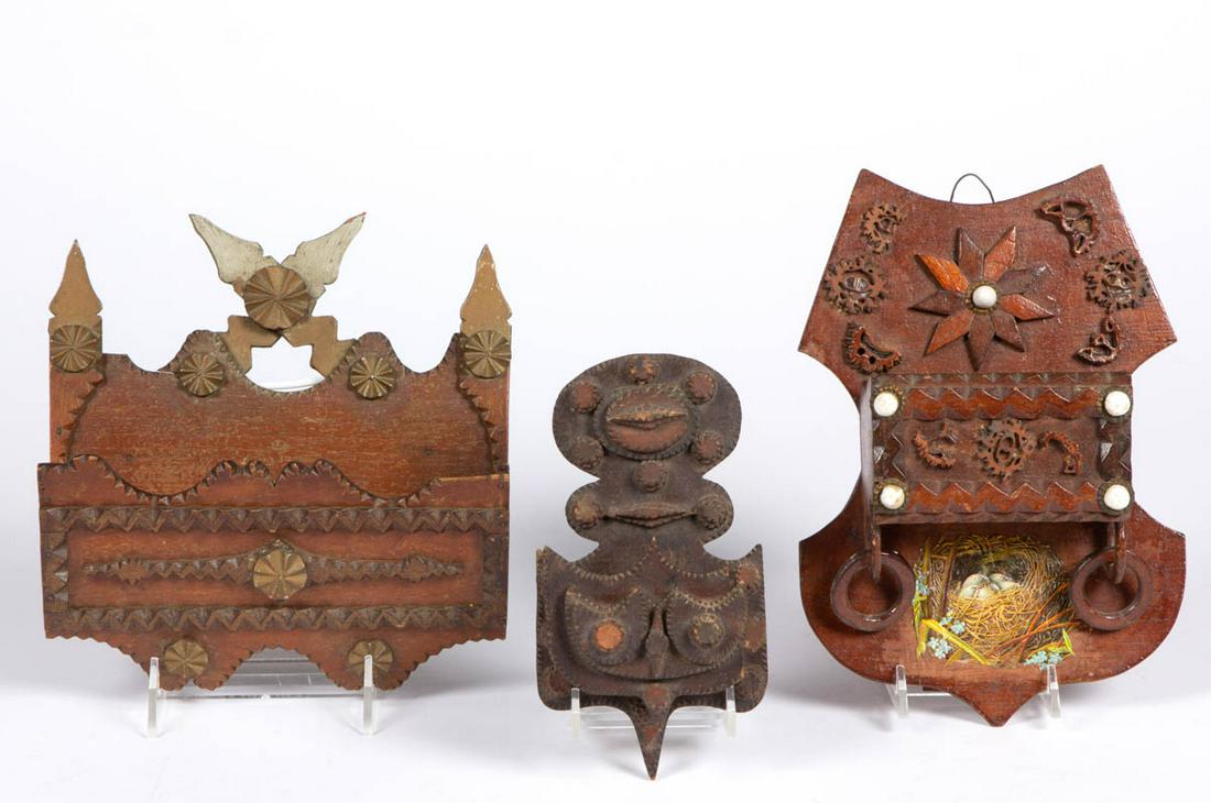 AMERICAN FOLK / TRAMP ART WALL POCKETS, LOT OF THREE: AMERICAN FOLK / TRAMP ART WALL POCKETS, LOT OF THREE, each featuring chip-carved and applied decorations, retaining original surface, one example with additional porcelain button and decal embellishme
