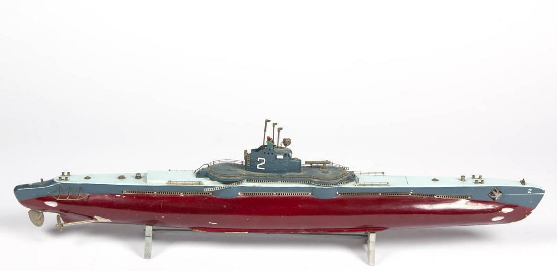 FOLK ART PAINTED SUBMARINE MODEL: FOLK ART PAINTED SUBMARINE MODEL, possibly depicting a World War II / WW2 Gato-class submarine, top can detach for battery operation of propellers. 20th century. 26 1/2" L.Very good overall condition,