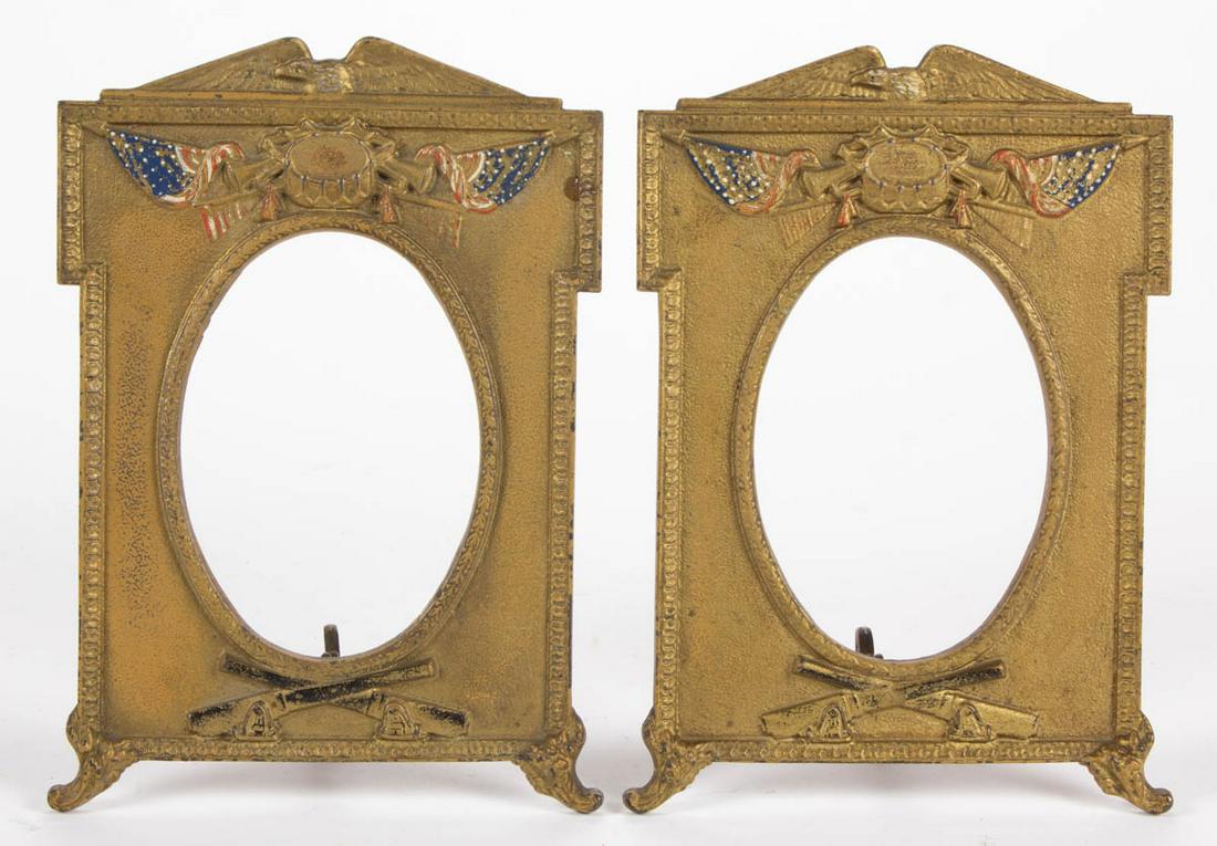 WORLD WAR ONE / WWI ERA PAINTED CAST-IRON PAIR OF: WORLD WAR ONE / WWI ERA PAINTED CAST-IRON PAIR OF PICTURE FRAMES, each stamped "9445", featuring patriotic eagle above American flags with central drum, over crossing cannons. H.L. Judd Co., Connectic