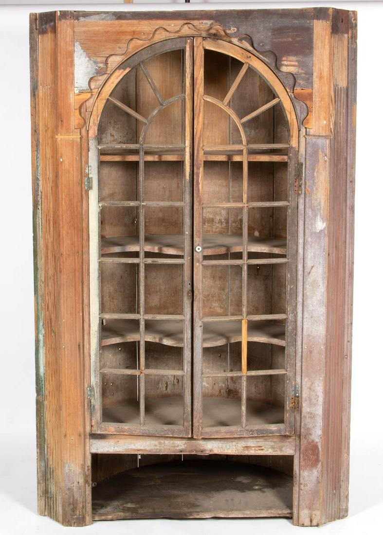 SOUTHERN, POSSIBLY VIRGINIA, YELLOW PINE ARCHITECTURAL: SOUTHERN, POSSIBLY VIRGINIA, YELLOW PINE ARCHITECTURAL CORNER CUPBOARD, barrel-back form originally built in, featuring two arched doors, concealing three-fixed shaped shelves. Retains traces of an ol