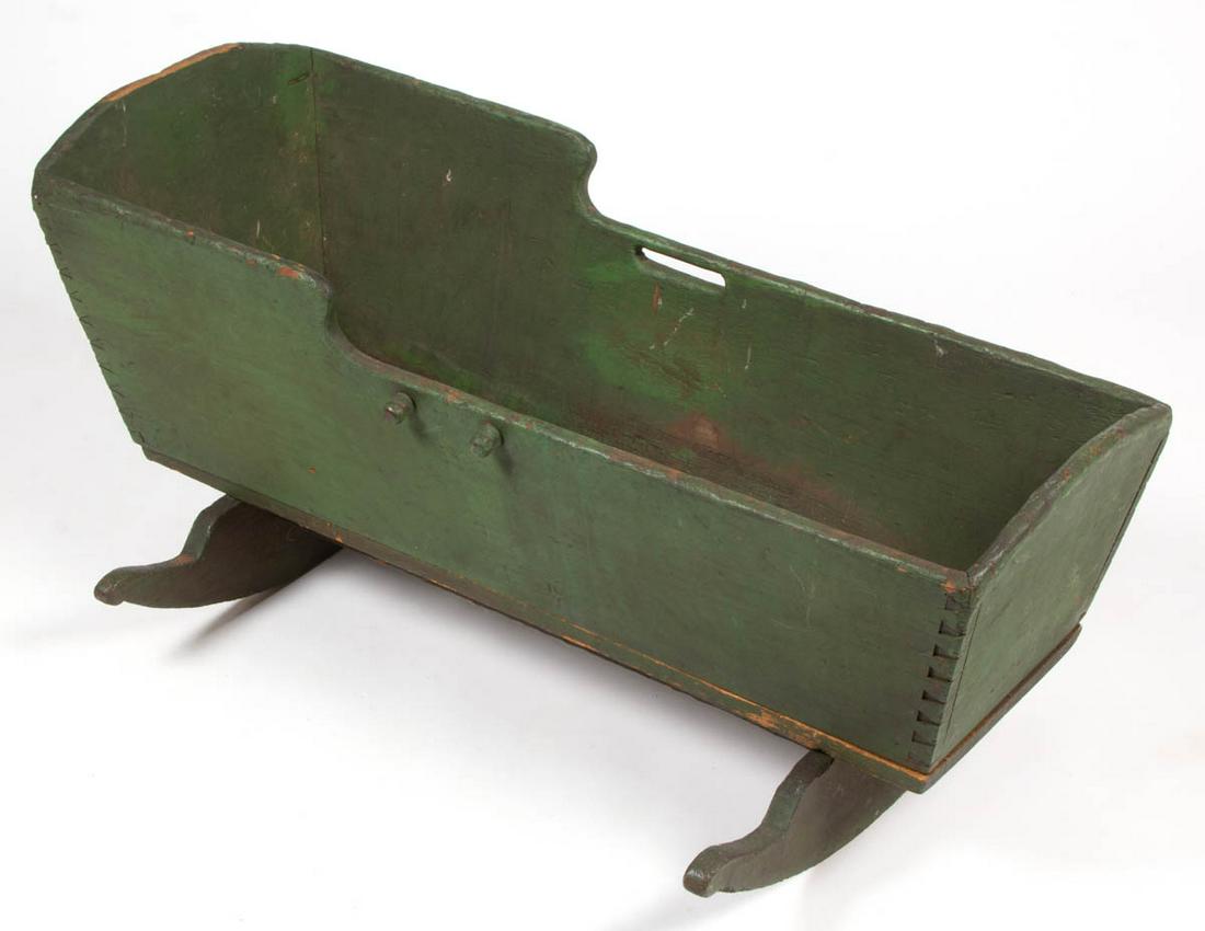AMERICAN PAINTED PINE AND POPLAR CRADLE: AMERICAN PAINTED PINE AND POPLAR CRADLE, dovetailed construction with shaped sides and oak rockers. Retaining an early green-painted surface. Probably Mid-Atlantic, possibly Pennsylvania. First half 1