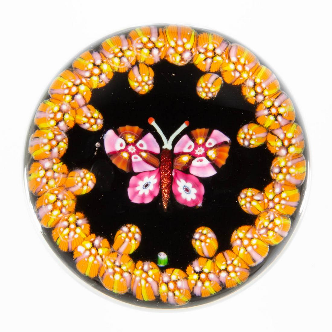 EARLY PAUL YSART (SCOTTISH, 1904-1979) MILLEFIORI: EARLY PAUL YSART (SCOTTISH, 1904-1979) MILLEFIORI BUTTERFLY ART GLASS PAPERWEIGHT, encasement having a grey tint, central butterfly with red aventurine body supporting fuchsia and burnt orange millefi
