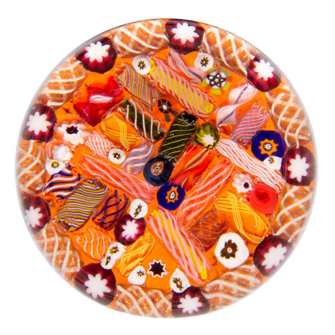 EARLY PAUL YSART (SCOTTISH, 1904-1979) ATTRIBUTED: EARLY PAUL YSART (SCOTTISH, 1904-1979) ATTRIBUTED SCRAMBLED MILLEFIORI ART GLASS MAGNUM PAPERWEIGHT, encasement having a purple tint, array of varying filigree tubes and scattered millefiori canes all