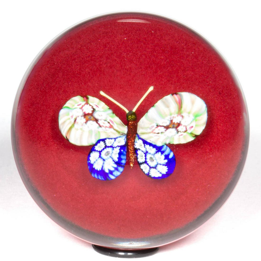 PAUL YSART (SCOTTISH, 1904-1979) MILLEFIORI BUTTERFLY: PAUL YSART (SCOTTISH, 1904-1979) MILLEFIORI BUTTERFLY ART GLASS PAPERWEIGHT, central butterfly with red aventurine body, blue and multi-colored millefiori wings, green aventurine head, all above an op