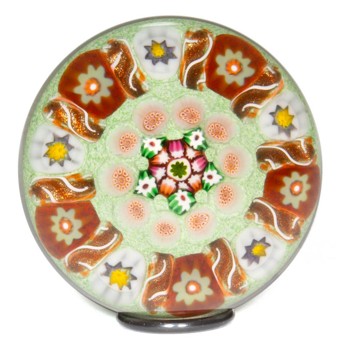 EARLY PAUL YSART (SCOTTISH, 1904-1979) ATTRIBUTED: EARLY PAUL YSART (SCOTTISH, 1904-1979) ATTRIBUTED CONCENTRIC MILLEFIORI ART GLASS PAPERWEIGHT, central pentagonal millefiori configuration encircled by an adjacent ring of crystal and red complex cane