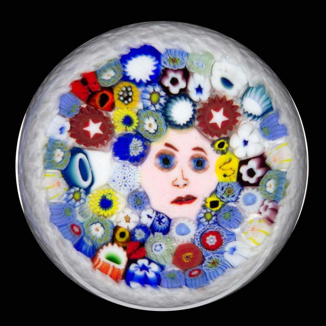 CHRIS SHERWIN (AMERICAN, B. 1968) MURRINE AND: CHRIS SHERWIN (AMERICAN, B. 1968) MURRINE AND MILLEFIORI STUDIO ART GLASS PAPERWEIGHT, central murrine face cane with blue millefiori eyes, surrounded by a variety of millefiori canes in many colors a