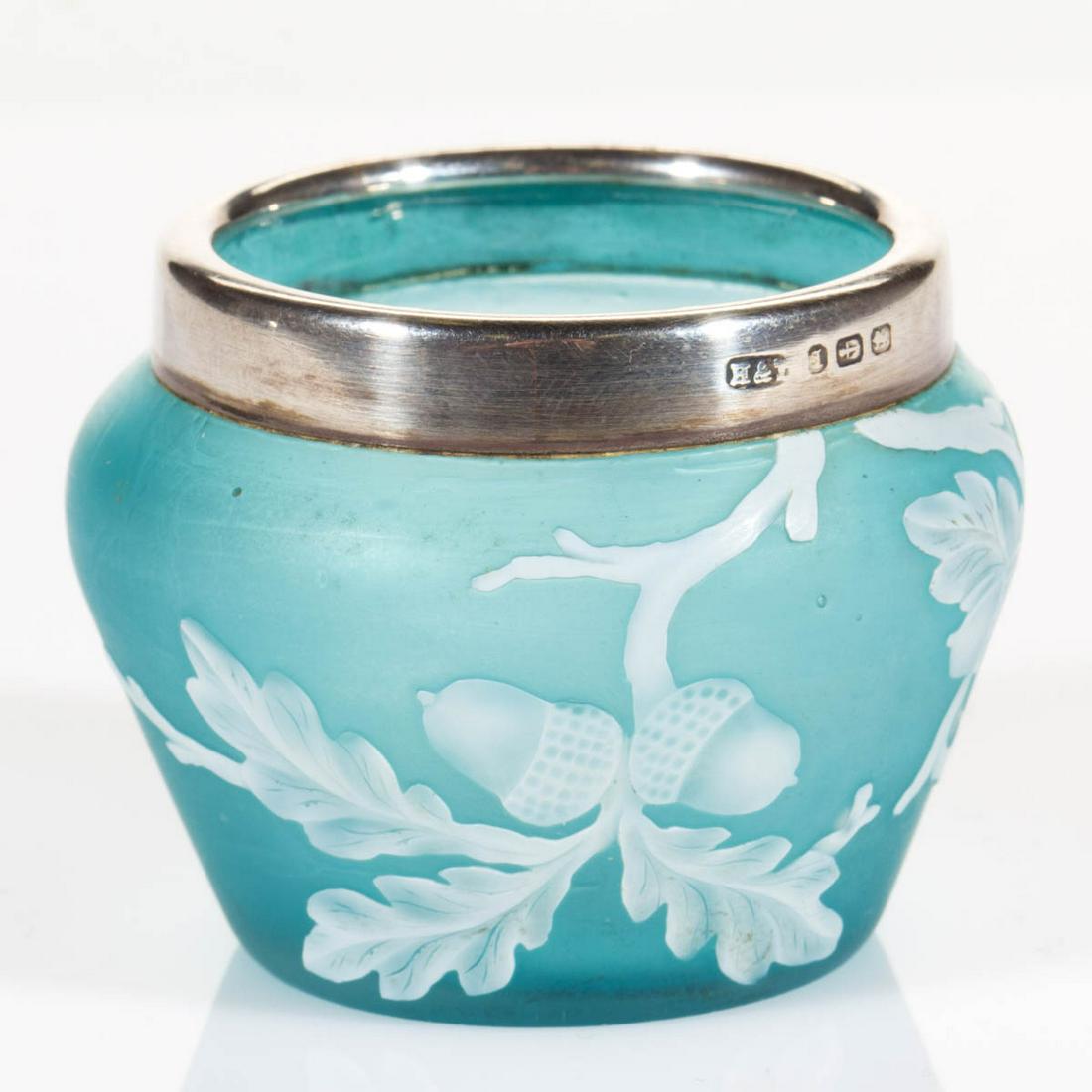 ENGLISH CAMEO ART GLASS OPEN SALT: ENGLISH CAMEO ART GLASS OPEN SALT, white to blue, urn form with acorns and branches, applied silver-plated rim marked for Hamilton & Inches, factory-polished base and pontil mark. Thomas Webb or Steve