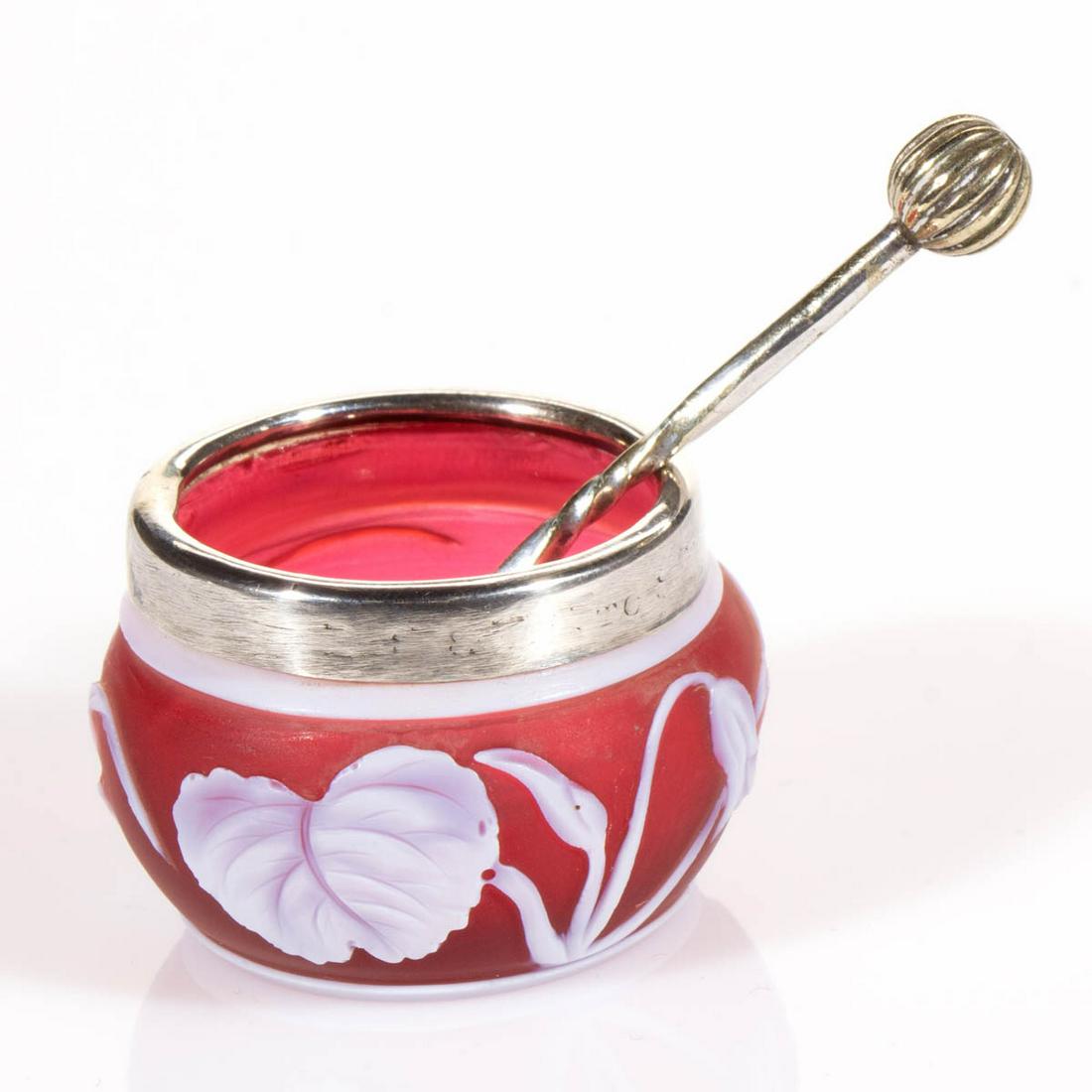 ENGLISH CAMEO ART GLASS DIMINUTIVE OPEN SALT: ENGLISH CAMEO ART GLASS DIMINUTIVE OPEN SALT, white to ruby, floral pattern, applied silver-plated rim with English hallmarks, factory-polished base and pontil mark, with spoon. Thomas Webb or Stevens