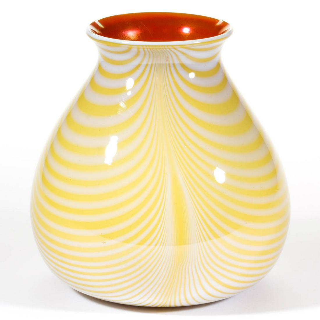 IMPERIAL LEAD LUSTRE ART GLASS VASE: IMPERIAL LEAD LUSTRE ART GLASS VASE, yellow ground with opal loopings, orange iridescent interior, bulbous form, polished pontil mark. Imperial Glass Co. Circa 1925. 6 1/2" H.Undamaged with some scatt