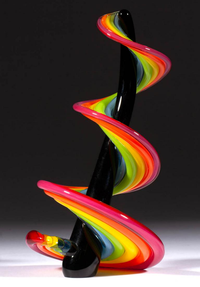 VITRIX HEECHEE SERIES STUDIO ART GLASS SCULPTURE: VITRIX HEECHEE SERIES STUDIO ART GLASS SCULPTURE, having a black interior pole with a rainbow swirl applied to and spiraling around, signed to the base edge, polished base and edge of application for 