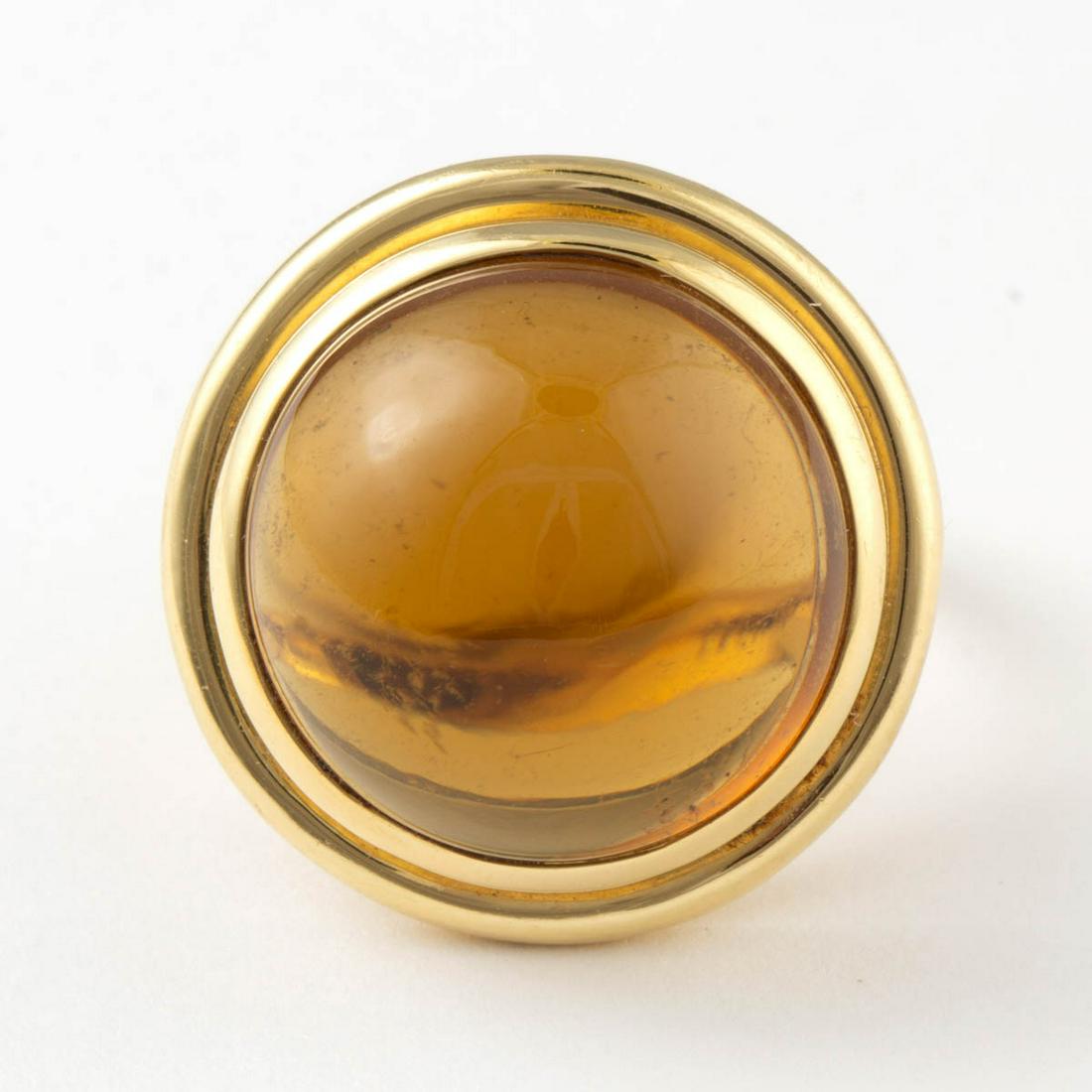PALOMA PICASSO FOR TIFFANY & CO. 18K YELLOW GOLD AND: PALOMA PICASSO FOR TIFFANY & CO. 18K YELLOW GOLD AND CITRINE RING, having a large 19 mm round citrine cabochon in bezel setting on split-shank band, including a Tiffany & Co. blue cloth pouch. Interio