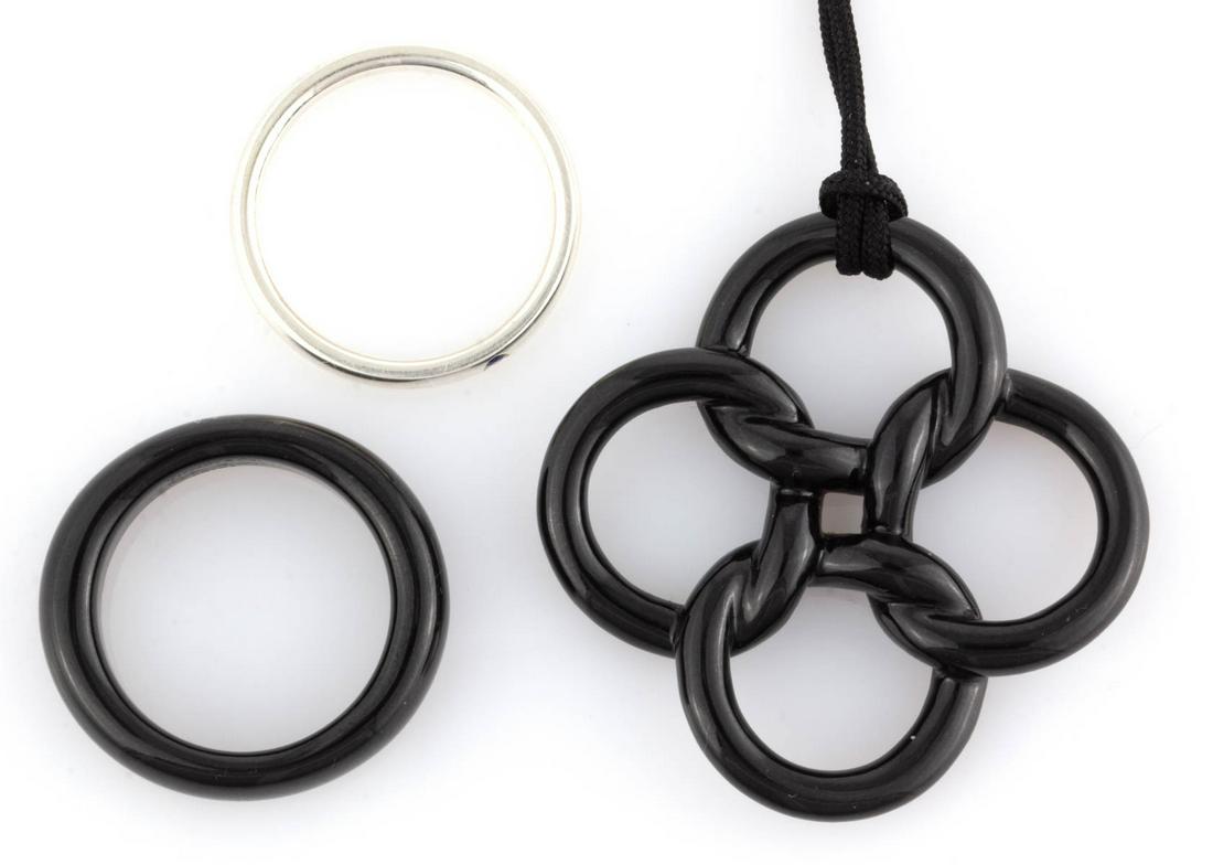 ELSA PERETTI FOR TIFFANY & CO. STERLING SILVER AND: ELSA PERETTI FOR TIFFANY & CO. STERLING SILVER AND OTHER JEWELRY ARTICLES, LOT OF THREE, comprising a sterling silver stacking ring with a small round-cut blue stone, a "Quadrifoglio" black jade penda