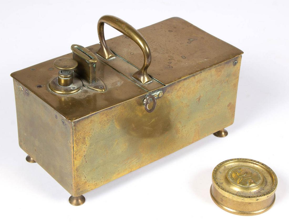 ENGLISH BRASS "RICH'S PATENT" TOBACCO HONOR BOX: ENGLISH BRASS "RICH'S PATENT" TOBACCO HONOR BOX, rectangular case raised on turned feet, two locking hinged compartments, one end with a coin slot and plunger, and arched center handle, rubbed maker's