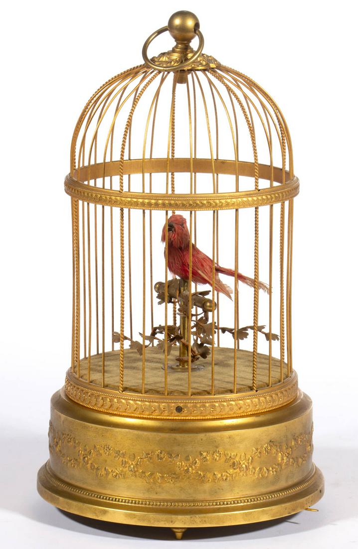 FRENCH WIND-UP BIRD CAGE MUSICAL AUTOMATON: FRENCH WIND-UP BIRD CAGE MUSICAL AUTOMATON, circular gilt-brass cage containing a single bird on a perch, stamped "132" by switch, marked "MADE IN FRANCE" under base and with serial number "5432531". 