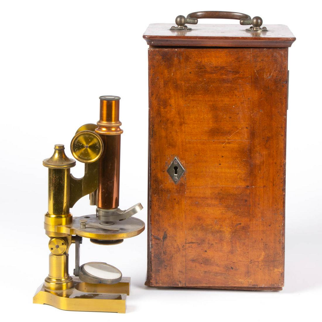 E. LEITZ WETZLAR BRASS MICROSCOPE WITH TRAVELING CASE: E. LEITZ WETZLAR BRASS MICROSCOPE WITH TRAVELING CASE, stamped "E. LEITZ" with serial number "No. 23227". Reserve. Late 19th/first quarter 20th century. Case 13 1/2" HOA. Unknown completeness, weights