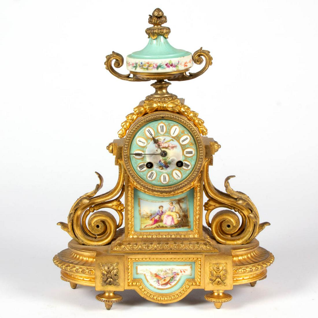 FRENCH SEVRES-STYLE ORMOLU MANTLE CLOCK: FRENCH SEVRES-STYLE ORMOLU MANTLE CLOCK, featuring two lower panels and clock face and urn to top having polychrome hand-painted floral decoration, cupid, courting scene, and mandolin, back of dial st