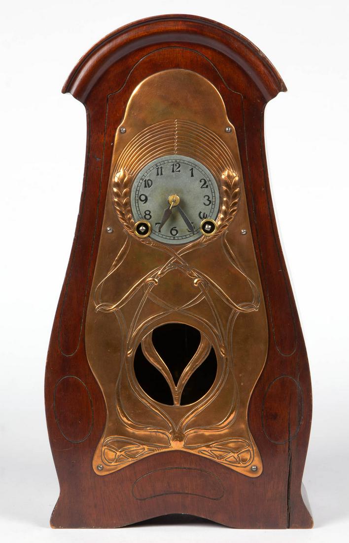 GUSTAV BECKER GERMAN ART NOUVEAU MANTLE CLOCK: GUSTAV BECKER GERMAN ART NOUVEAU MANTLE CLOCK, dial with serial number "1835190" and with "GB" and anchor hallmark, case with embossed copper front plate depicting wheat, pendulum present. Old surface