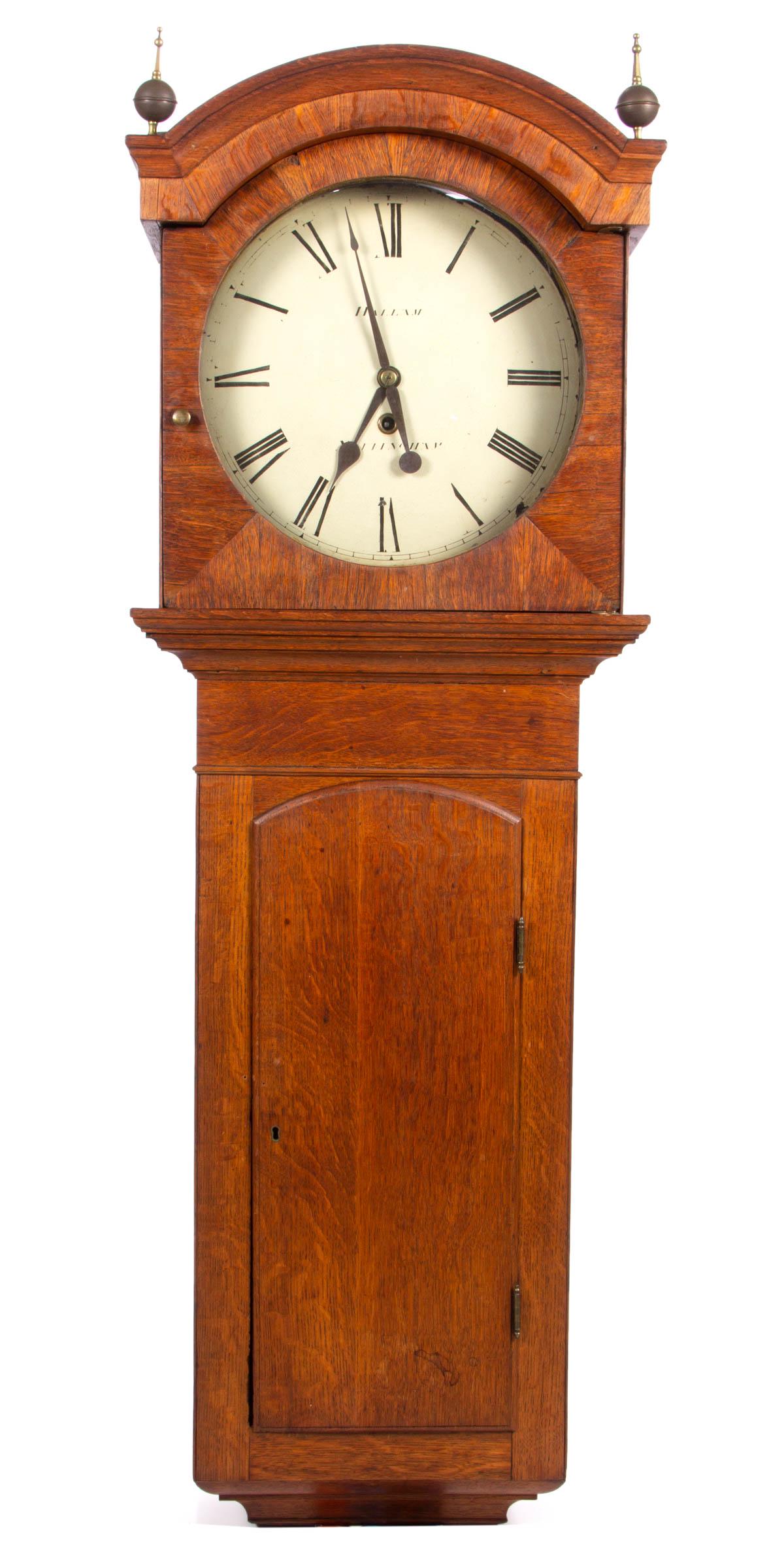 ENGLISH OAK PUB / PUBLIC WALL CLOCK: ENGLISH OAK PUB / PUBLIC WALL CLOCK, eight-day brass movement, painted sheet-iron dial marked "HALLAM / NOTTINGHAM", retaining winding key, pendulum, possibly original ball-and-spire finials and an ea