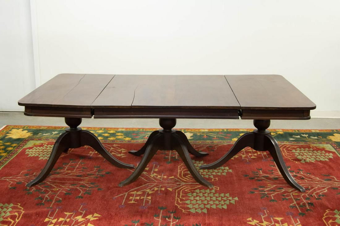 WEST INDIAN THREE-PART CLASSICAL-STYLE MAHOGANY BANQUET: WEST INDIAN THREE-PART CLASSICAL-STYLE MAHOGANY BANQUET TABLE, each top supported by a substantial baluster standard raised on down swept reeded legs. Old surface with rich color. 19th century. 29 1/4