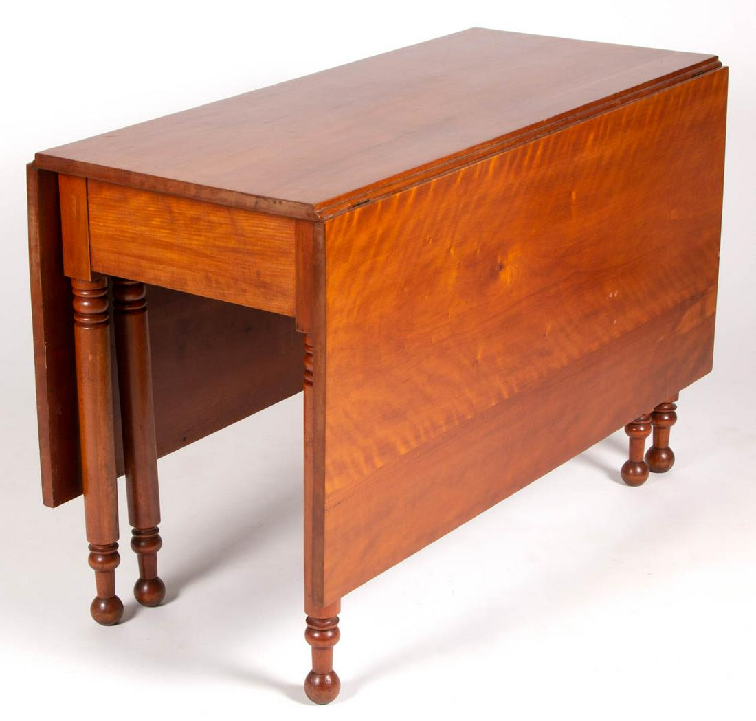 AMERICAN LATE FEDERAL FIGURED CHERRY FALL-LEAF DINING: AMERICAN LATE FEDERAL FIGURED CHERRY FALL-LEAF DINING TABLE, the rectangular top with two hinged drop leaves, raised on four turned-legs terminating in ball feet. Retains an old surface with warm colo