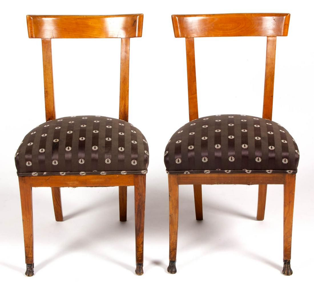 PAIR OF BIEDERMEIER SIDE CHAIRS: PAIR OF BIEDERMEIER SIDE CHAIRS, probably beech or maple, featuring front legs terminating in carved paw feet, likely later upholstery. Old surface with mild color. 19th century. 32" HOA, 18 1/2" H se