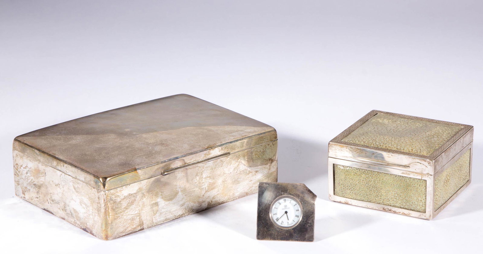 ENGLISH AND CONTINENTAL STERLING AND 0.900 SILVER DESK: ENGLISH AND CONTINENTAL STERLING AND 0.900 SILVER DESK AND SMOKING ARTICLES, LOT OF THREE, comprising a small sterling and shagreen cigarette box with wood interior lining by English maker Walker & Ha