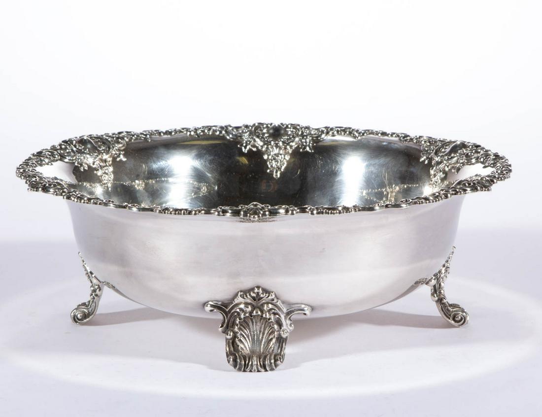 THEODORE B. STARR STERLING SILVER FOOTED BOWL: THEODORE B. STARR STERLING SILVER FOOTED BOWL, round form having flared rim featuring ornate design with scrolls, beading, shells, and flowers, interior base with personalized engraving of "1870 R 189