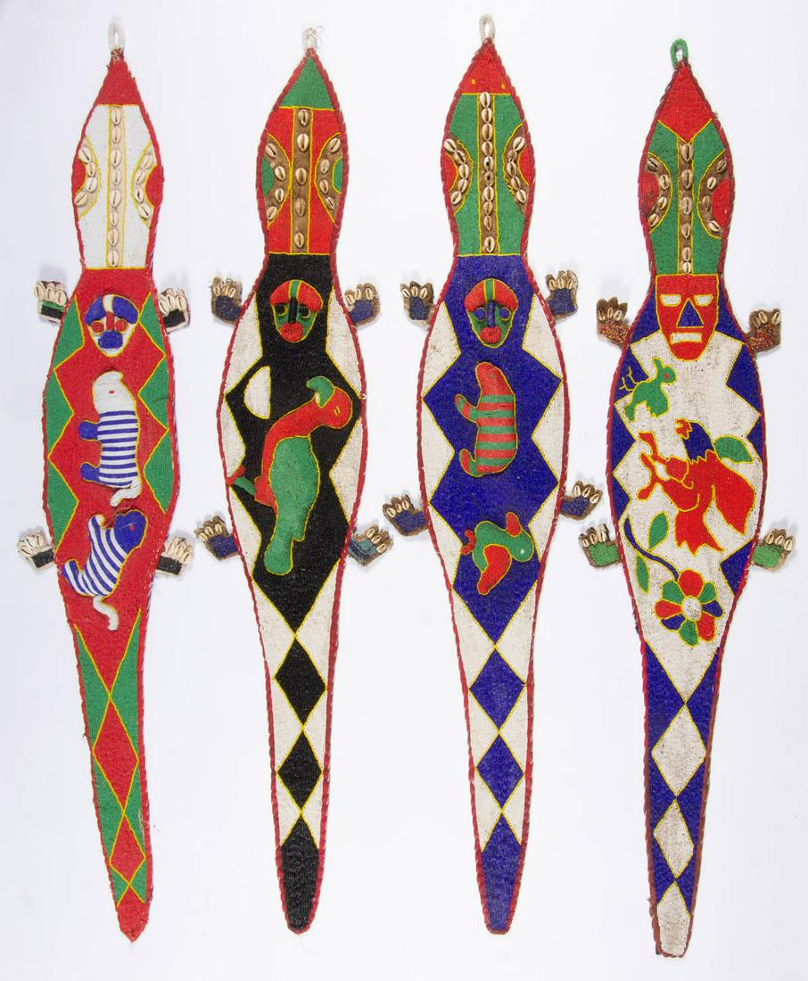 AFRICAN TRIBAL BEADED WALL HANGING, LOT OF FOUR: AFRICAN TRIBAL BEADED WALL HANGING, LOT OF FOUR, including three shaped like lizards, with raised figures of animals, each with cowrie shells. Probably Yoruba. 20th century. One 54 1/2" LOA. Very good