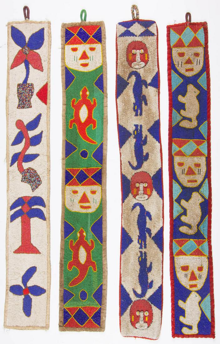 AFRICAN TRIBAL BEADED WALL HANGING, LOT OF FOUR: AFRICAN TRIBAL BEADED WALL HANGING, LOT OF FOUR, featuring figures of faces, reptiles, flowers, and animals, each with likely original hanger. Probably Yoruba. One 50 1/4" LOA.Very good overall condit