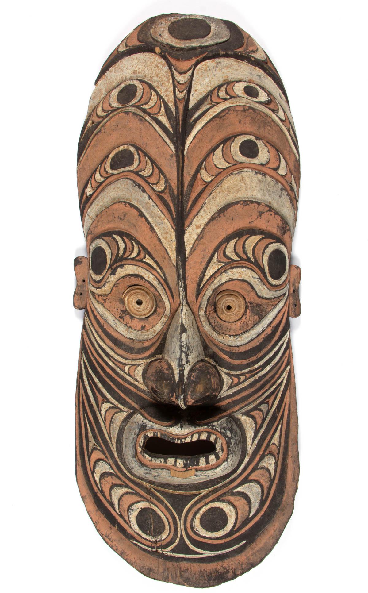 NEW GUINEA CARVED AND PAINTED SEPIK MASK: NEW GUINEA CARVED AND PAINTED SEPIK MASK, with insert conus shell discs. With accompanying copied appraisal letter from Harmer Johnson, New York City, with Merton Simpson, New York provenance, and hav
