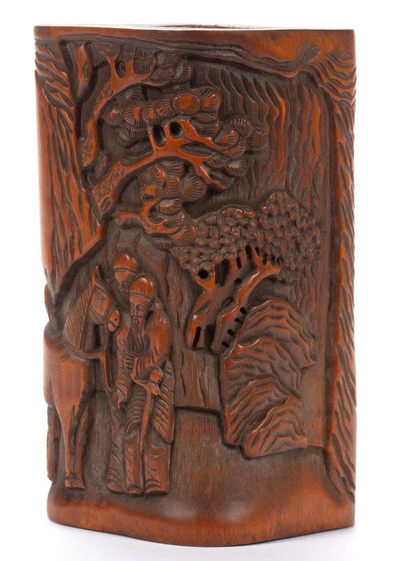 CHINESE CARVED BAMBOO BRUSH POT: CHINESE CARVED BAMBOO BRUSH POT, typical form with finely carved depiction of soldiers and horse against a stylized landscape ground, inscription to one side, retaining an old surface with warm color.