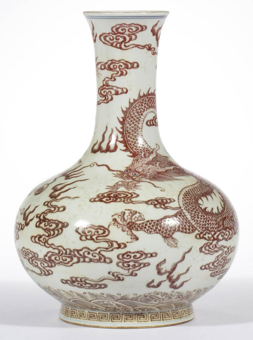 CHINESE EXPORT PORCELAIN QING-STYLE VASE: CHINESE EXPORT PORCELAIN QING-STYLE VASE, bottle form, featuring two blue-eyed red dragons chasing a flaming pearl. Having blue Qianlong archaic seal mark to underside. Marked for Qianlong period 1736