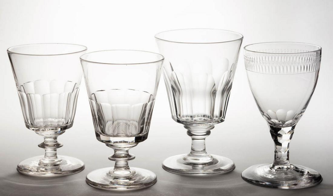 ASSORTED BLOWN AND CUT GLASS GOBLETS, LOT OF FOUR: ASSORTED BLOWN AND CUT GLASS GOBLETS, LOT OF FOUR, colorless lead glass, comprising a pair of 11-panel, a nine-flute, and a floral engraved band with a cut-faceted stem. Various makers. 19th century. 