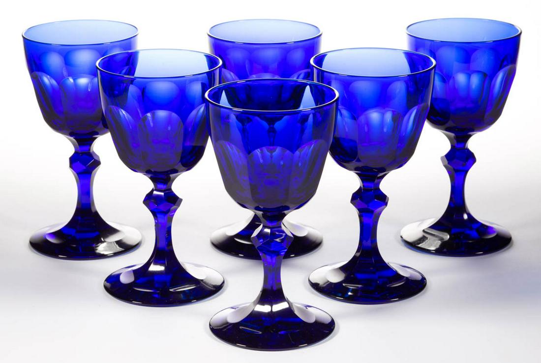 CUT FLUTED GLASS WINES, LOT OF SIX: CUT FLUTED GLASS WINES, LOT OF SIX, cobalt blue, each having deep bowls with eight flute cuts, raised on a single-knop stem with a cut-faceted knop and flutes extending onto the top of the foot. Maker