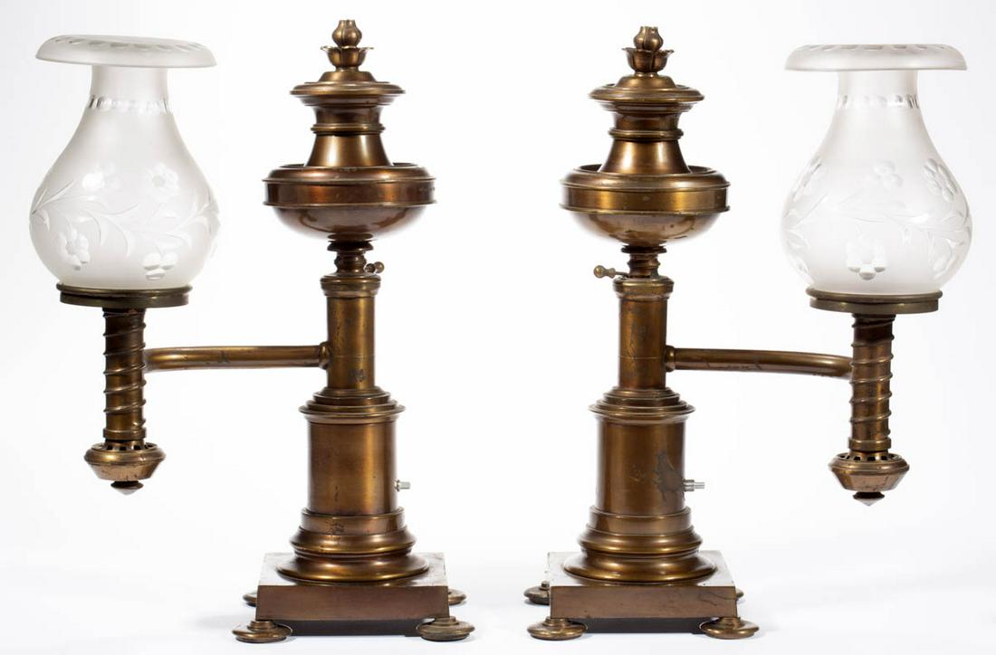 BRASS MANTLE PAIR OF ARGAND LAMPS: BRASS MANTLE PAIR OF ARGAND LAMPS, each with single-arm featuring urn-form font having a fuel adjustment lever and a floral finial, contoured brass arm and burner tube with a spiraling thread, multi-s