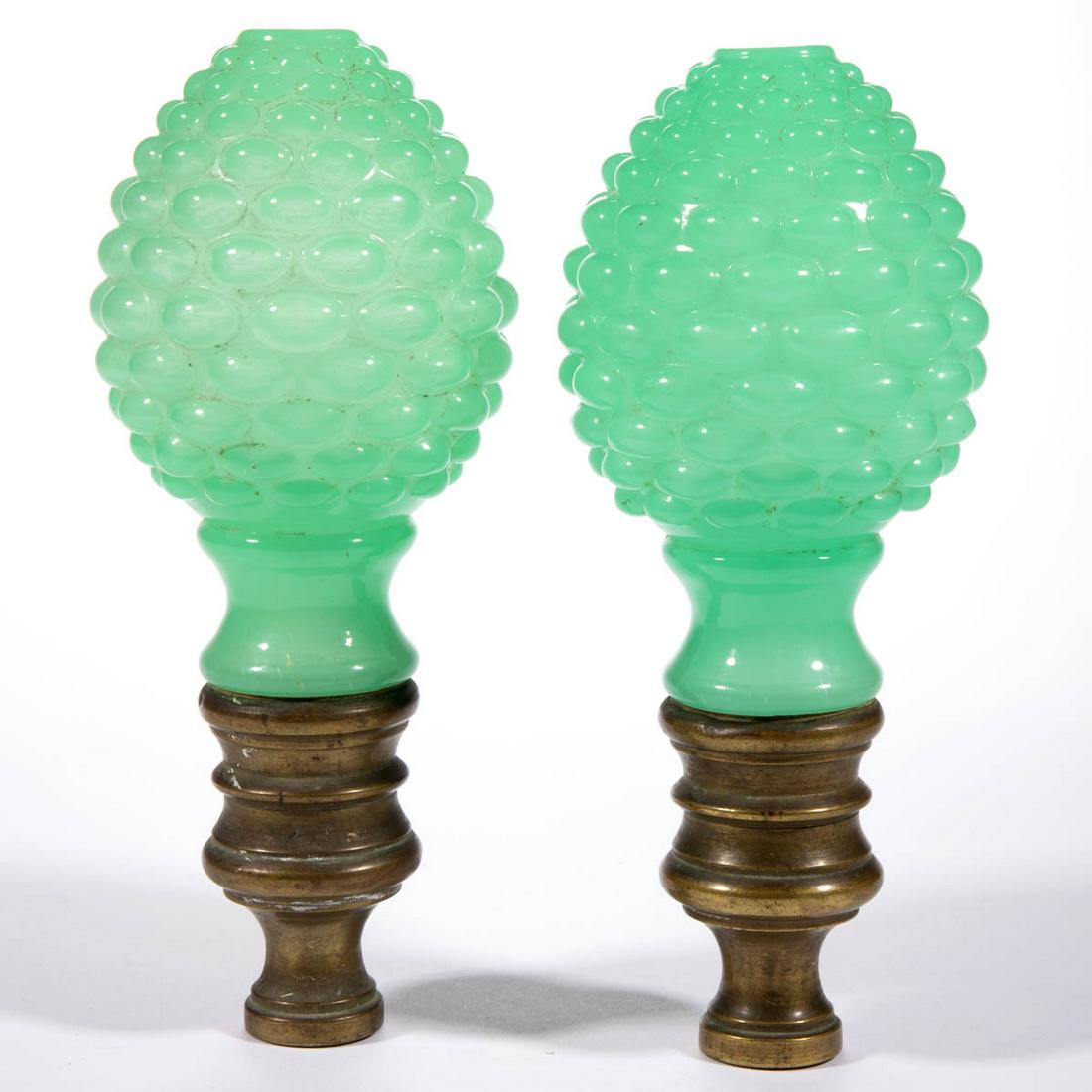 BLOWN-MOLDED OVAL HOBNAIL PAIR OF FINIALS: BLOWN-MOLDED OVAL HOBNAIL PAIR OF FINIALS, translucent jade green, each egg-shape with factory polished top, plastered into a brass mount. Probably for a newel post. Boston & Sandwich Glass Co. and ot