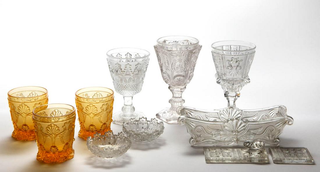ASSORTED FRENCH LACY GLASS ARTICLES, LOT OF NINE,: ASSORTED FRENCH LACY GLASS ARTICLES, LOT OF NINE,, amber and colorless, including three tumblers with a matching pattern, three goblets with varying patterns, and a covered rectangular dish. 1840-1860