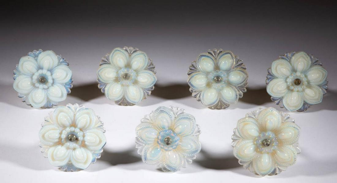 PRESSED ROSETTE MEDIUM-SIZE CURTAIN PINS / TIE BACKS,: PRESSED ROSETTE MEDIUM-SIZE CURTAIN PINS / TIE BACKS, LOT OF SEVEN, light to deep fiery opalescent, each having a period shank. Boston & Sandwich Glass Co. and others. 1840-1870. 4 1/4" DOA. One examp