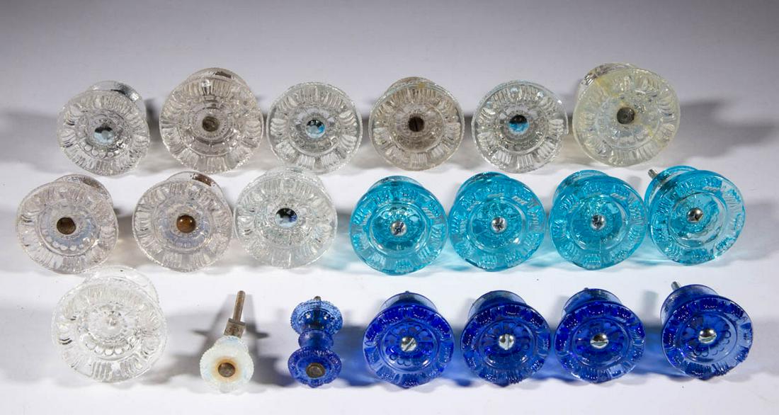 PRESSED SPLIT-PETAL GLASS FURNITURE KNOBS, LOT OF 20: PRESSED SPLIT-PETAL GLASS FURNITURE KNOBS, LOT OF 20, colorless, fiery opalescent, light blue, and deep blue, including ten antique examples with two being of a diminutive size, and a seven reproducti