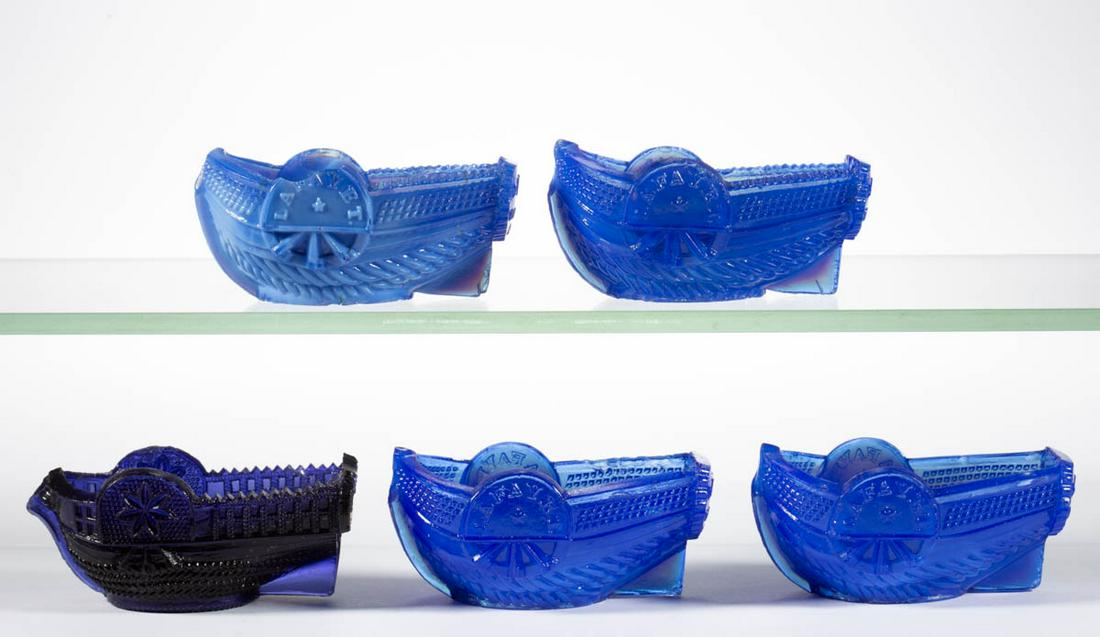 ASSORTED PRESSED BOAT-FORM OPEN SALTS, LOT OF FIVE: ASSORTED PRESSED BOAT-FORM OPEN SALTS, LOT OF FIVE, comprising a blue purple BT-2, two opaque blue BT-5, an opaque blue BT-8, and an opaque silver blue BT-8. Very rare. Stourbridge Flint Glass Works a
