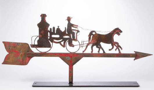 AMERICAN FOLK ART CUT-OUT SHEET-IRON FIRE PUMPER: AMERICAN FOLK ART CUT-OUT SHEET-IRON FIRE PUMPER WEATHERVANE, a naive example featuring horse-drawn fire pumper on a large directional arrow, retaining an old red-painted surface. Currently displayed