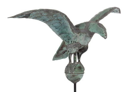 AMERICAN FOLK ART MOLDED-COPPER FULL-BODY DIMINUTIVE: AMERICAN FOLK ART MOLDED-COPPER FULL-BODY DIMINUTIVE EAGLE WEATHERVANE / FINIAL, figure perched on an orb, retaining original verdigris patination. Currently displayed on a custom iron stand. Late