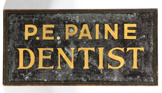 AMERICAN FOLK ART PAINTED TIN TRADE SIGN: AMERICAN FOLK ART PAINTED TIN TRADE SIGN, double-sided rectangular form with stenciled gilt lettering for "P. E. PAINE / DENTIST" on a black schmaltz ground, in original molded wooden frame with